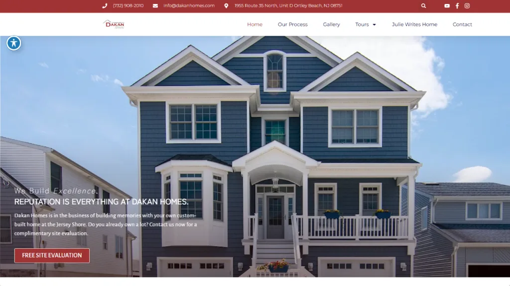 A large blue two-story house with white trim and a prominent gable roof stands in the foreground. The structure features multiple windows and a covered front porch, with other homes visible in the background, highlighting the neighborhood design suitable for web design for home rentals.